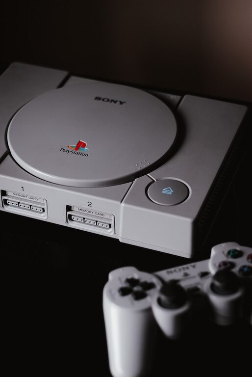 photo of closed Sony PS1 with DualShock 1 playstation