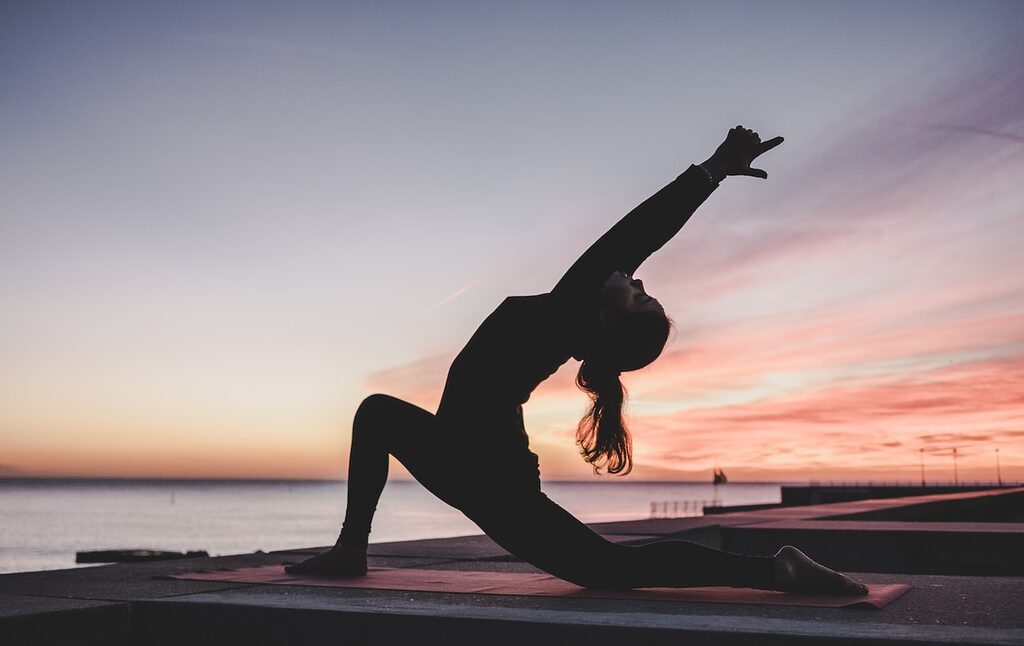 silhouette photography of woman doing yoga sport fitness health