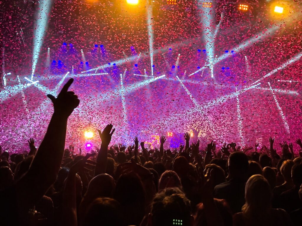 crowd raising their hands concert music